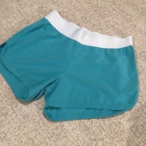 Teal and White Nike running shorts